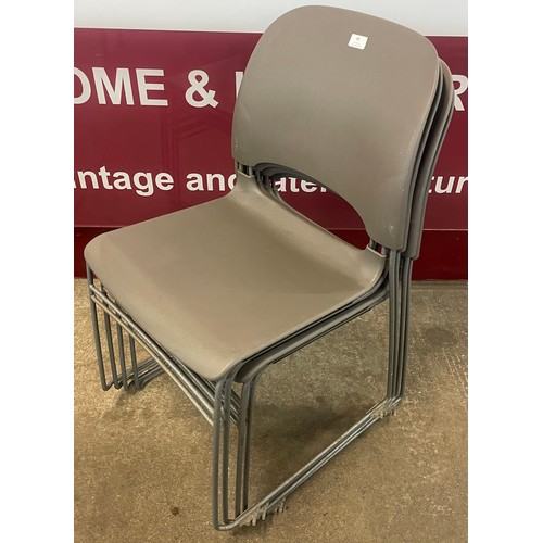 85 - A set of four Herman Miller grey plastic and tubular metal Limerick stacking chairs