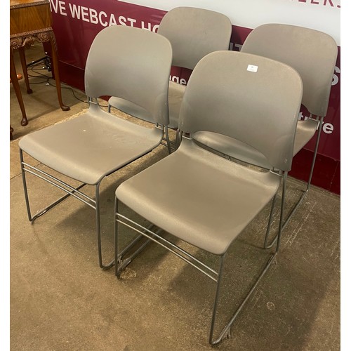 85 - A set of four Herman Miller grey plastic and tubular metal Limerick stacking chairs