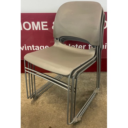 85A - A set of four Herman Miller grey plastic and tubular metal Limerick stacking chairs