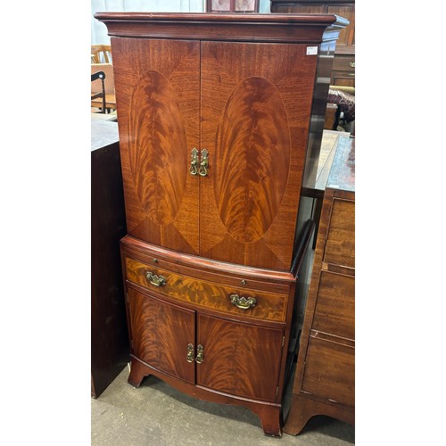 196 - A Regency style mahogany bowfront cocktail cabinet