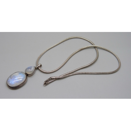 1002 - A large silver moonstone pendant on a silver chain, 37g, 5.8cm pendant