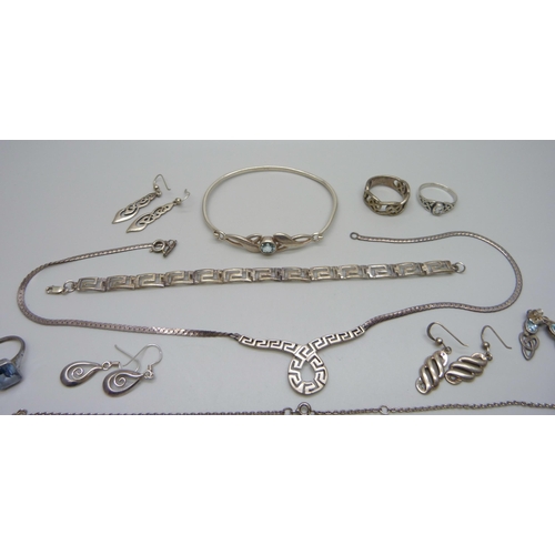 1008 - A collection of silver jewellery including a blue stone ring, necklaces and earrings, 63g