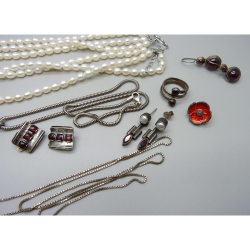 1016 - A three row pearl necklace with plated clasp, a plated pendant on a silver chain, a silver poppy pin... 