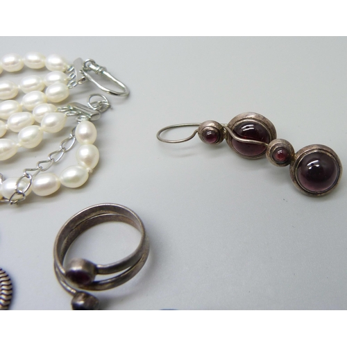 1016 - A three row pearl necklace with plated clasp, a plated pendant on a silver chain, a silver poppy pin... 