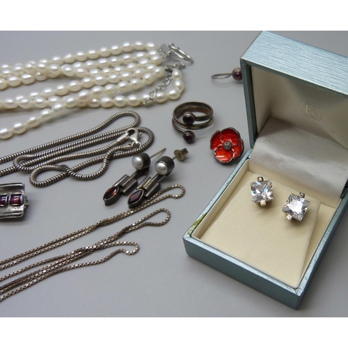 1016 - A three row pearl necklace with plated clasp, a plated pendant on a silver chain, a silver poppy pin... 