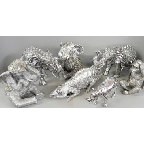 1028 - A collection of decorative elephants, chameleon and rhino **PLEASE NOTE THIS LOT IS NOT ELIGIBLE FOR... 