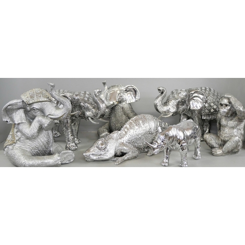 1028 - A collection of decorative elephants, chameleon and rhino **PLEASE NOTE THIS LOT IS NOT ELIGIBLE FOR... 