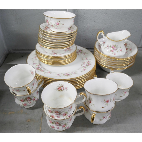 1031 - A set of Paragon Victoriana Rose, eight dinner plates, eight bowls, seven tea cups, nine saucers, ei... 