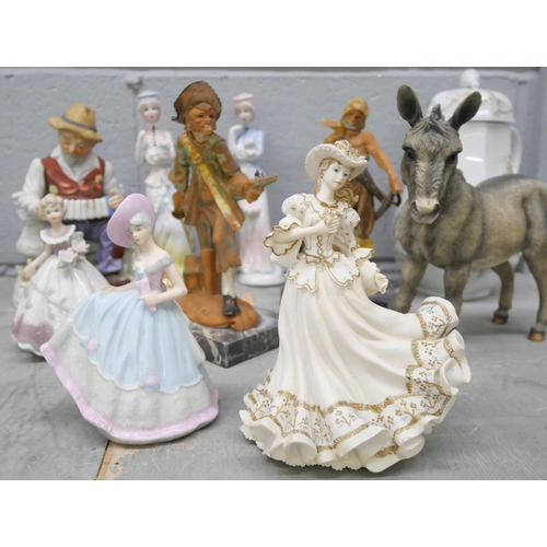 1037 - A collections of figures including fine ladies, two pirates, old gentleman on accordion and a donkey... 