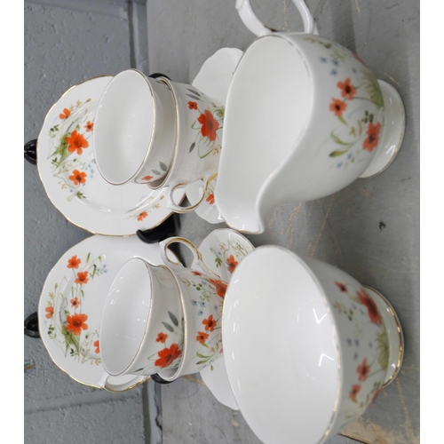 1047 - A Colclough tea set, cups, sauces, sugar bowl, milk jug, 11 plates and two large plates, together wi... 