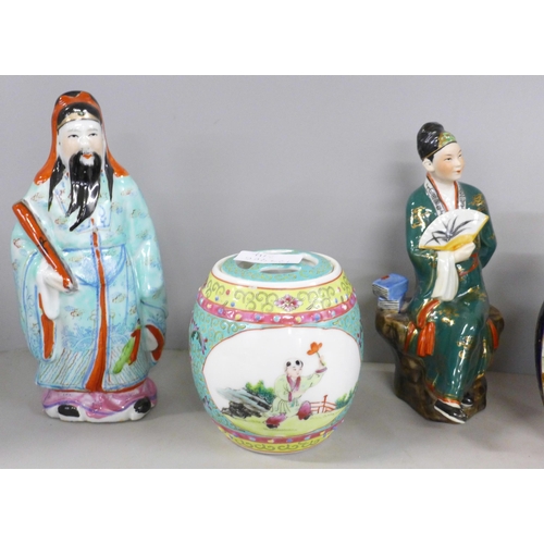 1062 - Three oriental figures, a Japanese Satsuma vase and pot (lacking lid), and a Chinese porcelain ginge... 