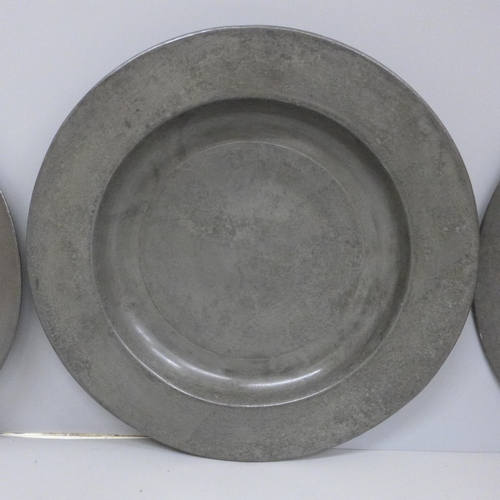 602 - Three pewter plates, all marked London