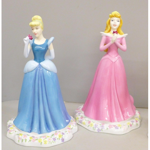 606 - Four Royal Doulton Showcase Collection figures, Cinderella x2, Sleeping Beauty and Snow White, all b... 