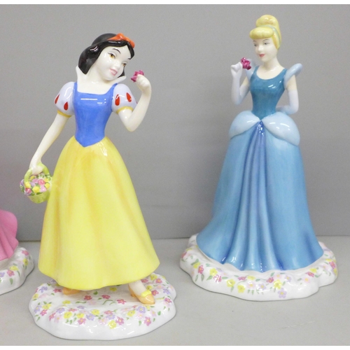 606 - Four Royal Doulton Showcase Collection figures, Cinderella x2, Sleeping Beauty and Snow White, all b... 