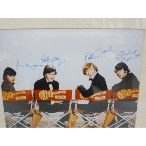 612 - A Monkees signed photograph display, with CoA, frame 33cm wide