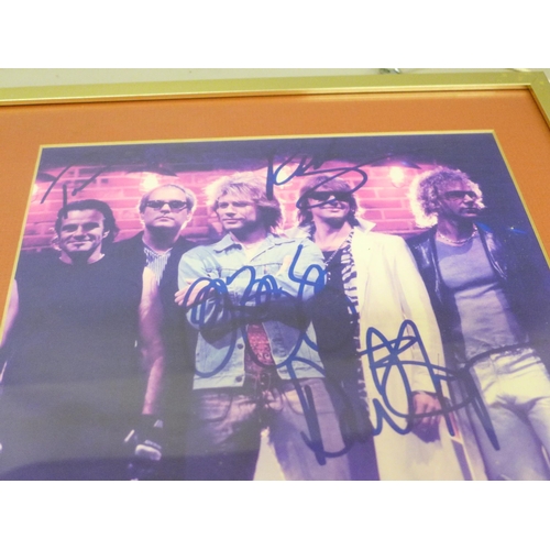 613 - A Bon Jovi signed picture display, no CoA, frame 33.5cm wide