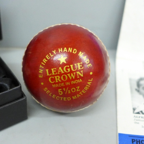 615 - A 1950 English Counties v The West Indies Souvenir, a signed cricket ball, Mike Atherton, and a pock... 