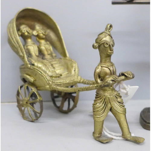 616 - A Dhokra model of a stylised processional Indian cart and a resin figure of a ballerina