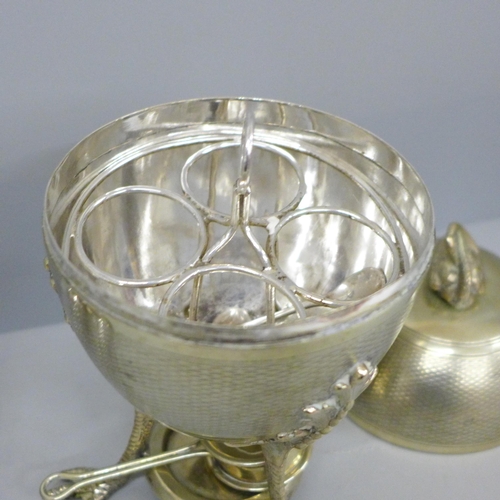 617 - A plated egg warmer by Mappin and Webb, a pair of silver salt spoons, an egg cup and two other spoon... 