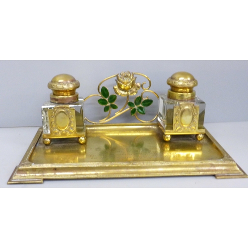 622 - A gilt metal inkstand with inscription, inkwells chipped