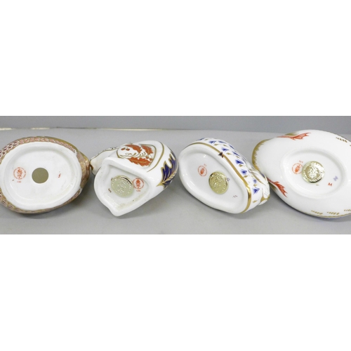 633 - Four Royal Crown Derby paperweights and three crested items