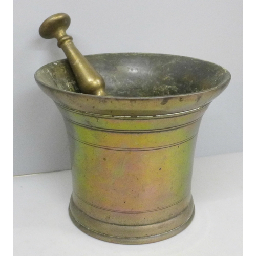 638 - A bronze pestle and mortar