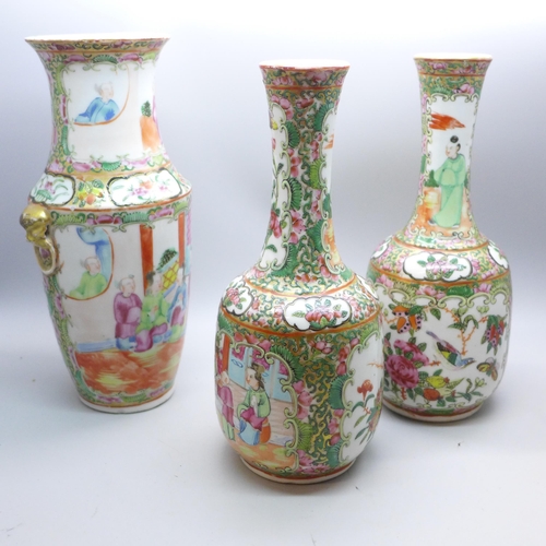 644 - A pair of Chinese famille rose vases, 20cm, and one other Chinese export vase, a/f (restored chip to... 