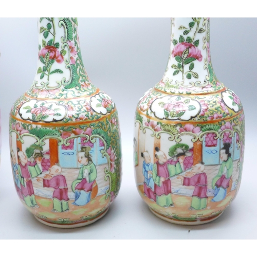 644 - A pair of Chinese famille rose vases, 20cm, and one other Chinese export vase, a/f (restored chip to... 