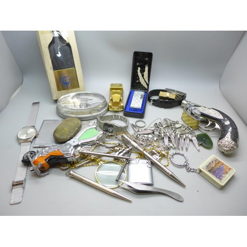 651 - A collection of assorted items including a stamp case and wristwatches