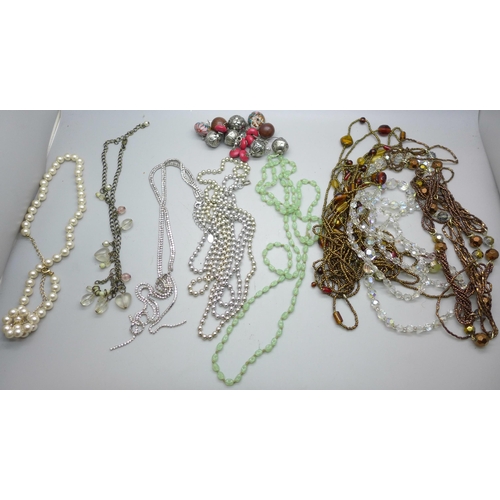 652 - A collection of necklaces, etc.