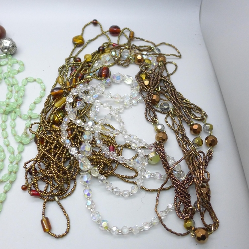 652 - A collection of necklaces, etc.