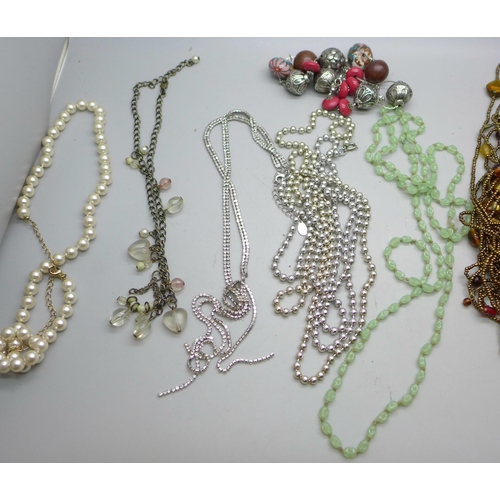 652 - A collection of necklaces, etc.