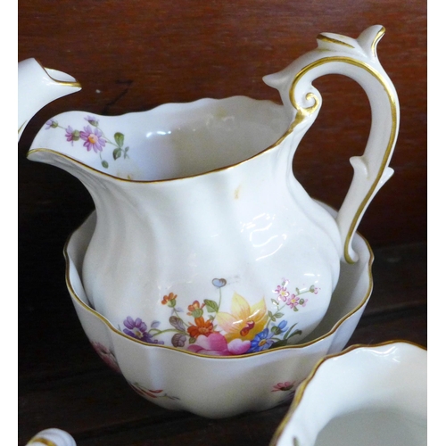 656 - A collection of Royal Crown Derby Posies including five jugs, a tea service with tea pot, sugar bowl... 