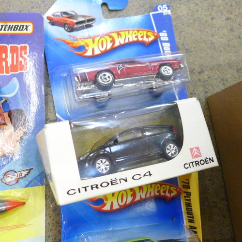 658 - A collection of nine Matchbox Hot Wheels, Oxford models including a CKO tin caravan, Tuk-Tuk and car... 