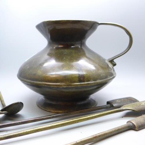 659 - A bronze jug and seven moulded tools