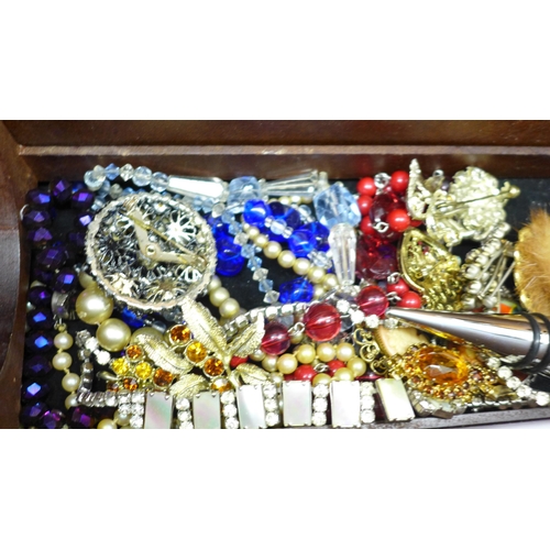 664 - Costume jewellery in a wine bottle box