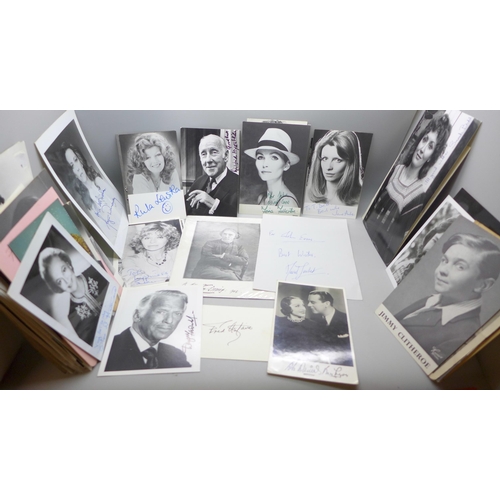 668 - A collection of approximately 75 celebrity photographs, most signed