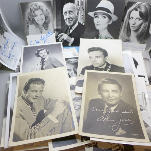 668 - A collection of approximately 75 celebrity photographs, most signed