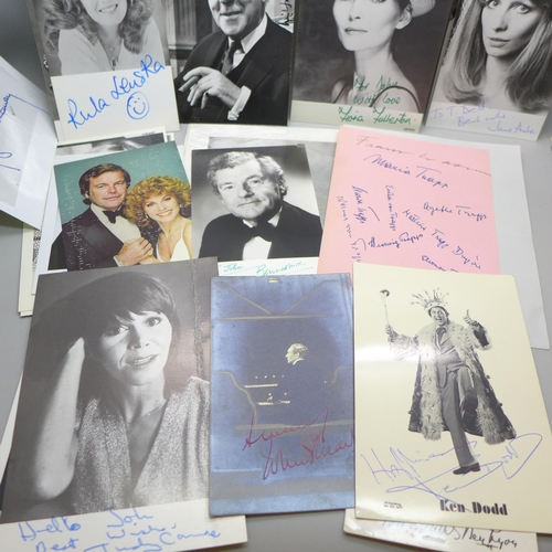 668 - A collection of approximately 75 celebrity photographs, most signed