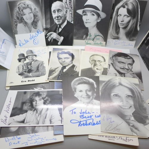 668 - A collection of approximately 75 celebrity photographs, most signed