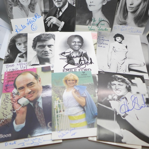 668 - A collection of approximately 75 celebrity photographs, most signed