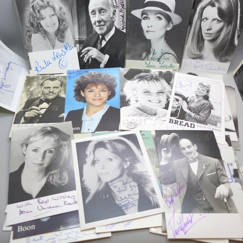 668 - A collection of approximately 75 celebrity photographs, most signed