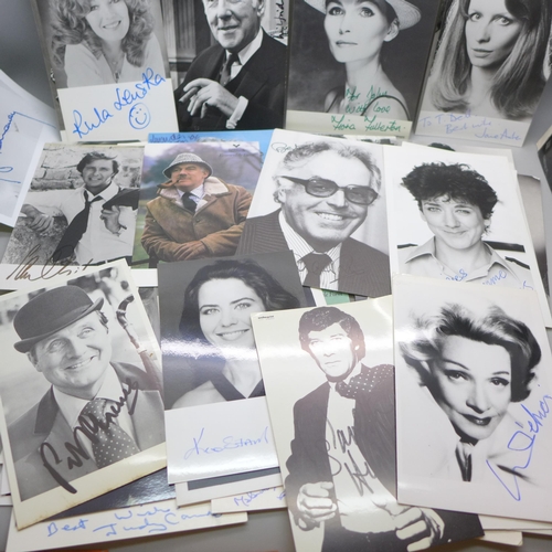 668 - A collection of approximately 75 celebrity photographs, most signed