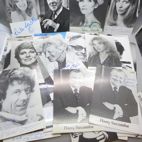 668 - A collection of approximately 75 celebrity photographs, most signed