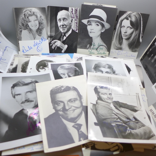 668 - A collection of approximately 75 celebrity photographs, most signed