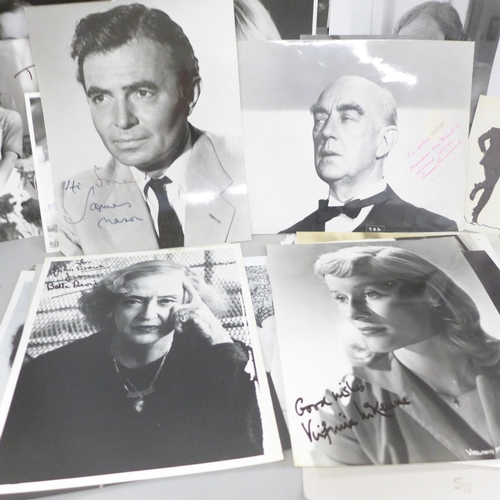 678 - A collection of approximately 40 celebrity photographs, most signed