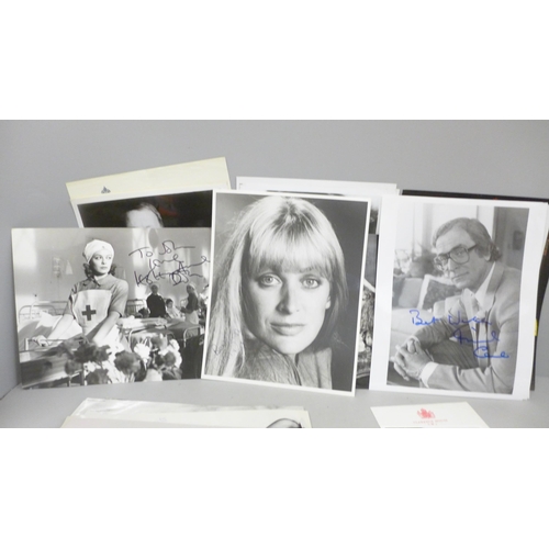 678 - A collection of approximately 40 celebrity photographs, most signed