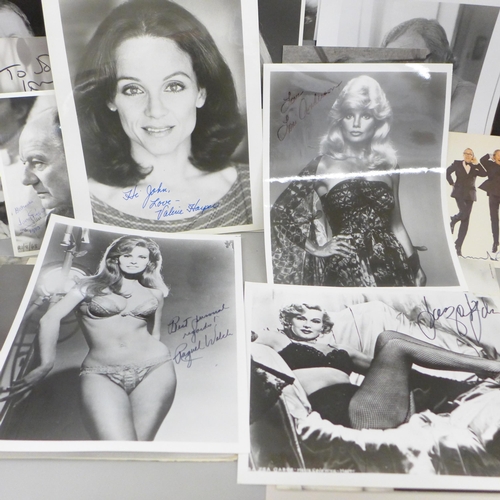 678 - A collection of approximately 40 celebrity photographs, most signed