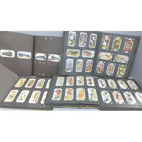 682 - Four albums of cigarette cards