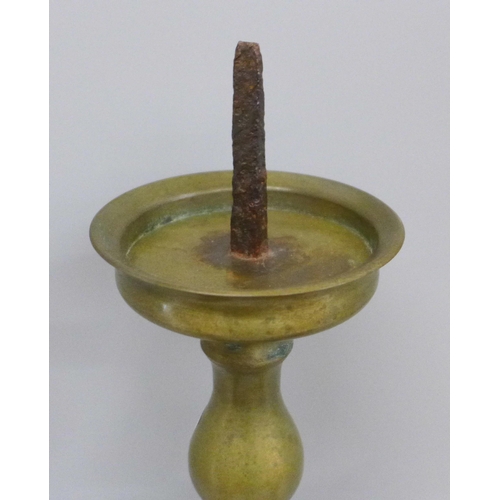 707 - Three candlesticks including one mounted on a wooden plinth